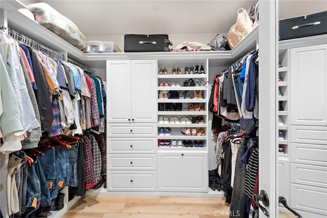 walk in closet featuring light wood-style flooring