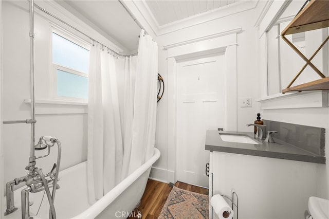 full bathroom with shower / bath combo, vanity, and wood finished floors