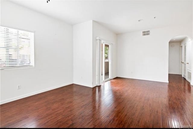 26364 Arboretum Way Unit 3301, Murrieta, CA 92563 - unfurnished room with visible vents, baseboards, arched walkways, and wood finished floors
