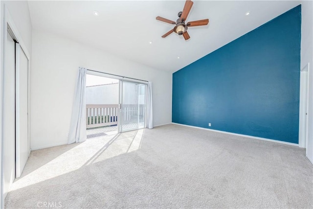 unfurnished bedroom featuring high vaulted ceiling, carpet flooring, access to outside, and ceiling fan