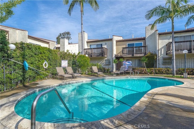 community pool featuring a patio area