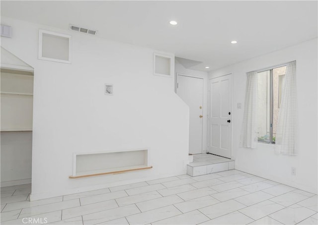 unfurnished room featuring recessed lighting and visible vents