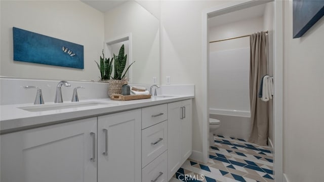 full bath featuring double vanity, shower / bath combination with curtain, toilet, and a sink
