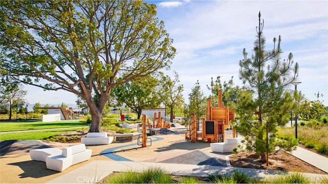 view of home's community featuring playground community