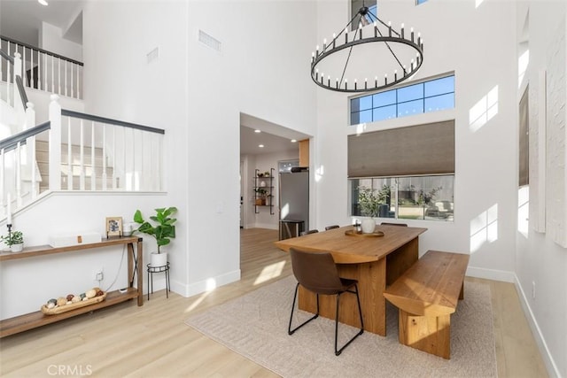 4355 Leonard Way, Corona, CA 92883 - dining room with baseboards, stairway, wood finished floors, and a towering ceiling