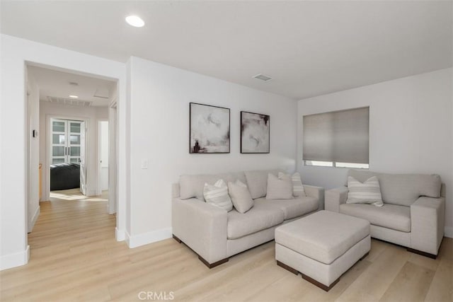 4355 Leonard Way, Corona, CA 92883 - living room featuring light wood-style floors, recessed lighting, visible vents, and baseboards