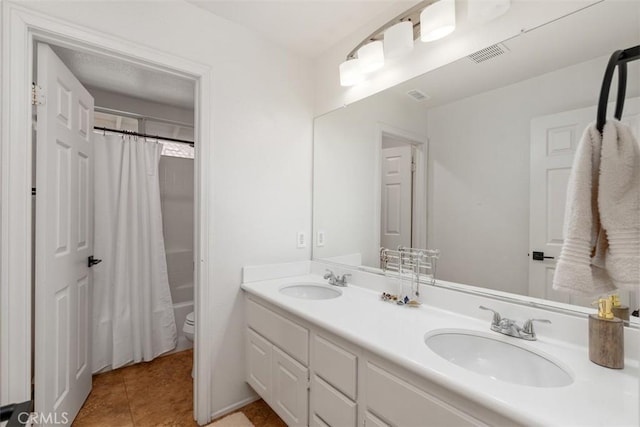 4355 Leonard Way, Corona, CA 92883 - bathroom featuring toilet, double vanity, a sink, and tile patterned flooring