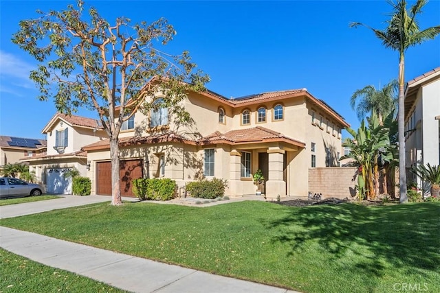 4355 Leonard Way, Corona, CA 92883 - mediterranean / spanish house with driveway, a tile roof, solar panels, stucco siding, and a garage