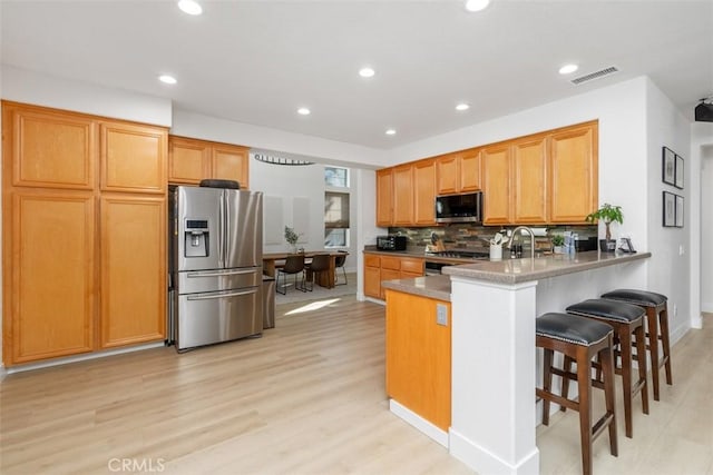4355 Leonard Way, Corona, CA 92883 - kitchen featuring appliances with stainless steel finishes, light wood-style floors, and recessed lighting