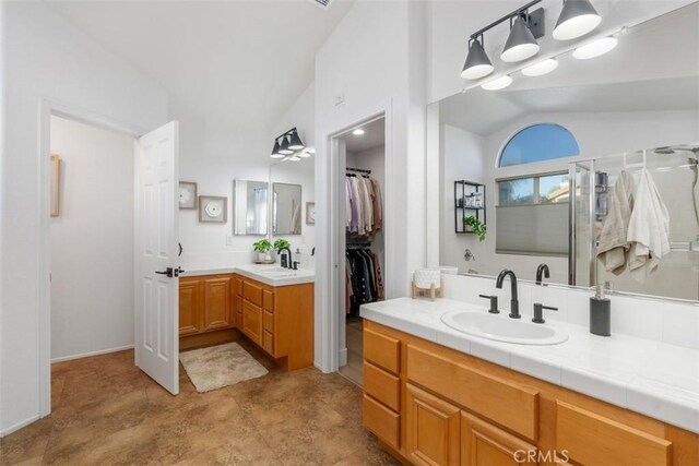 4355 Leonard Way, Corona, CA 92883 - full bathroom featuring a spacious closet, vanity, a shower with door, and vaulted ceiling