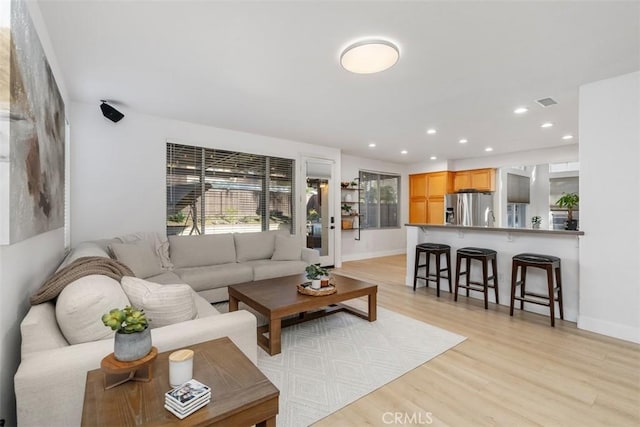 4355 Leonard Way, Corona, CA 92883 - living area featuring recessed lighting, light wood finished floors, visible vents, and baseboards