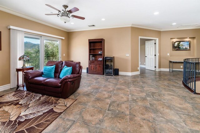 living area with wine cooler, visible vents, baseboards, and ceiling fan