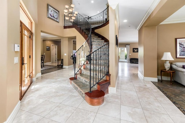entrance foyer with stairway, crown molding, and baseboards