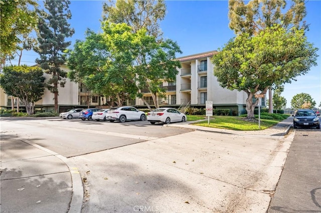 7201 Apricot Dr Unit 7201, Irvine, CA 92618 - view of building exterior featuring uncovered parking