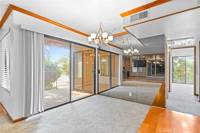 7201 Apricot Dr Unit 7201, Irvine, CA 92618 - unfurnished dining area featuring a chandelier and carpet