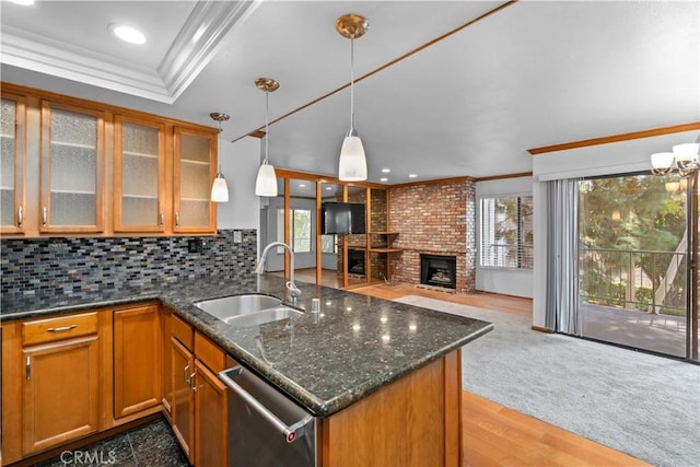7201 Apricot Dr Unit 7201, Irvine, CA 92618 - kitchen featuring dishwasher, crown molding, brown cabinets, open floor plan, and a brick fireplace