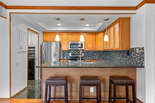 7201 Apricot Dr Unit 7201, Irvine, CA 92618 - kitchen with appliances with stainless steel finishes, granite tiled floors, crown molding, backsplash, and a peninsula