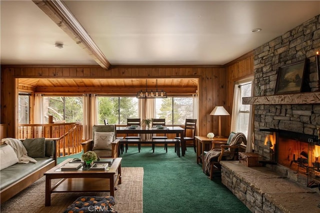 29196 Lake Brook Ave, Cedar Glen, CA 92321 - carpeted living area with wood walls, a stone fireplace, and beam ceiling