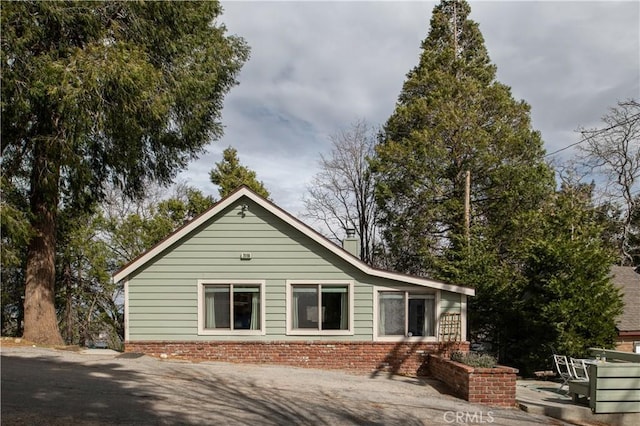 29196 Lake Brook Ave, Cedar Glen, CA 92321 - back of house with a chimney