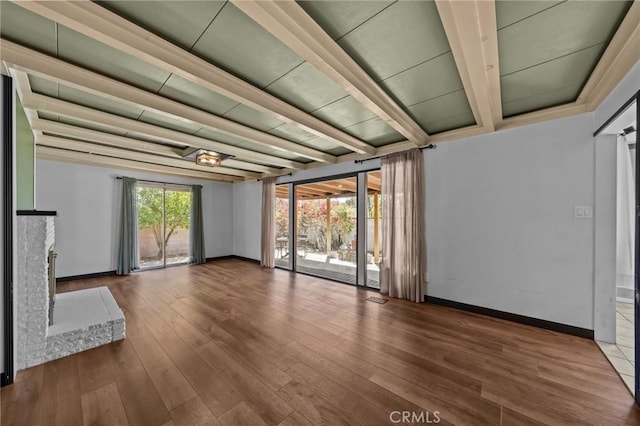 579 E 40th St, San Bernardino, CA 92404 - unfurnished living room with wood finished floors and baseboards