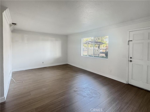 2414 Grove Ave, San Diego, CA 92154 - empty room featuring ornamental molding, dark wood-style floors, baseboards, and a textured ceiling