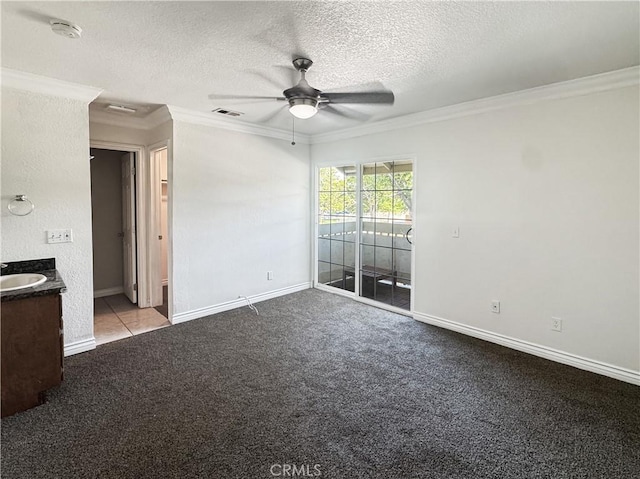 2414 Grove Ave, San Diego, CA 92154 - unfurnished bedroom featuring ornamental molding, a sink, a textured ceiling, access to exterior, and carpet flooring