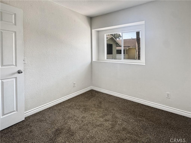 2414 Grove Ave, San Diego, CA 92154 - spare room featuring dark colored carpet and baseboards
