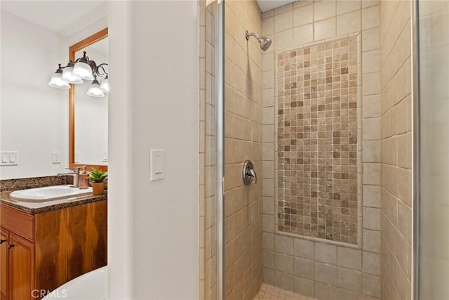 bathroom featuring a shower stall and vanity