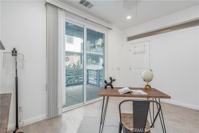 office area featuring light wood finished floors, baseboards, and recessed lighting