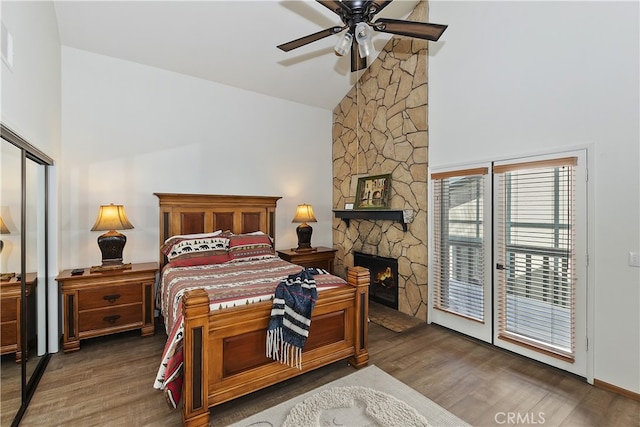 39802 Lakeview Dr Unit 26, Big Bear Lake, CA 92315 - bedroom featuring a fireplace, ceiling fan, wood finished floors, and high vaulted ceiling