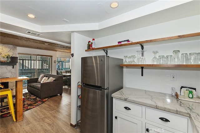 39802 Lakeview Dr Unit 26, Big Bear Lake, CA 92315 - kitchen featuring visible vents, open shelves, white cabinetry, freestanding refrigerator, and light wood-style floors