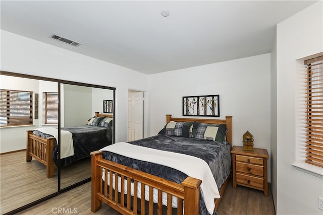 39802 Lakeview Dr Unit 26, Big Bear Lake, CA 92315 - bedroom featuring visible vents, a closet, and wood finished floors