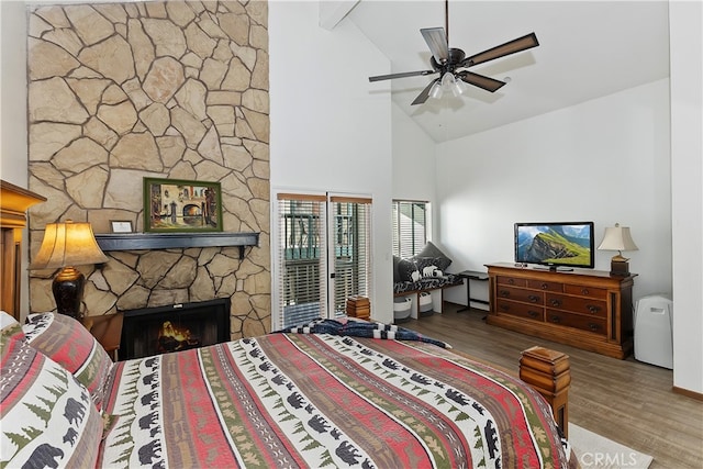 39802 Lakeview Dr Unit 26, Big Bear Lake, CA 92315 - bedroom featuring a fireplace, wood finished floors, and high vaulted ceiling