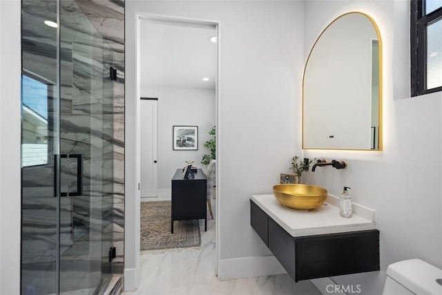 18802 Saginaw Dr, Irvine, CA 92603 - bathroom featuring marble finish floors, a marble finish shower, toilet, vanity, and baseboards