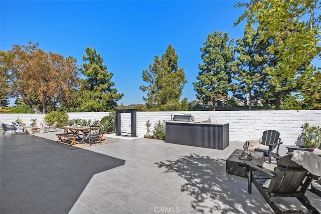 18802 Saginaw Dr, Irvine, CA 92603 - view of patio / terrace with a fire pit