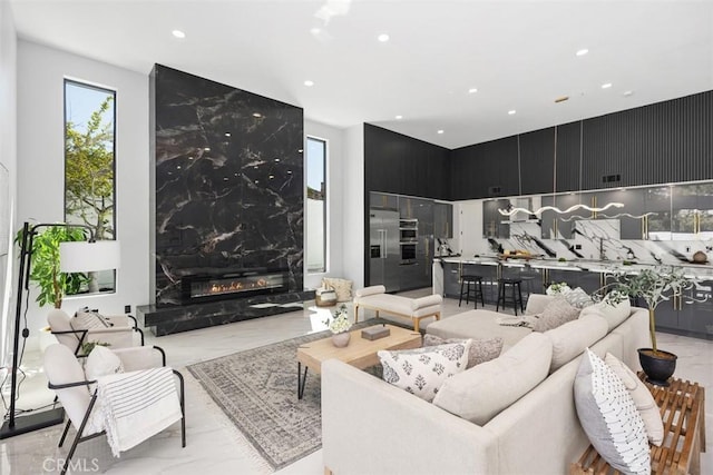 18802 Saginaw Dr, Irvine, CA 92603 - living area with recessed lighting and light marble finish floors
