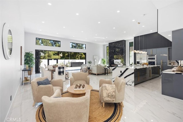 18802 Saginaw Dr, Irvine, CA 92603 - living area with light marble finish flooring, recessed lighting, and a towering ceiling