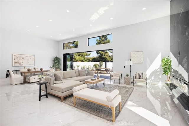 18802 Saginaw Dr, Irvine, CA 92603 - living area with light marble finish flooring, recessed lighting, and a high ceiling