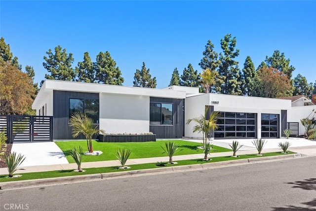 18802 Saginaw Dr, Irvine, CA 92603 - view of front of house with an attached garage, concrete driveway, and stucco siding