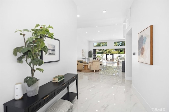 18802 Saginaw Dr, Irvine, CA 92603 - corridor with light marble finish floors, recessed lighting, and baseboards