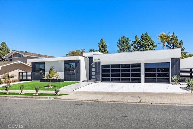 18802 Saginaw Dr, Irvine, CA 92603 - modern home featuring stucco siding and a garage