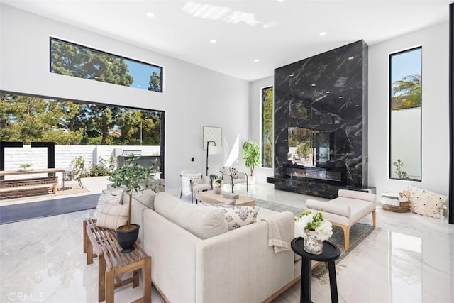 18802 Saginaw Dr, Irvine, CA 92603 - living room with plenty of natural light, recessed lighting, a high ceiling, and marble tiled floors
