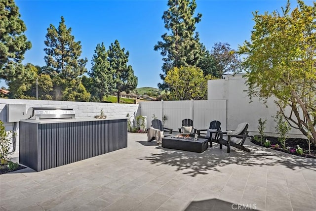 18802 Saginaw Dr, Irvine, CA 92603 - view of patio / terrace with an outdoor fire pit