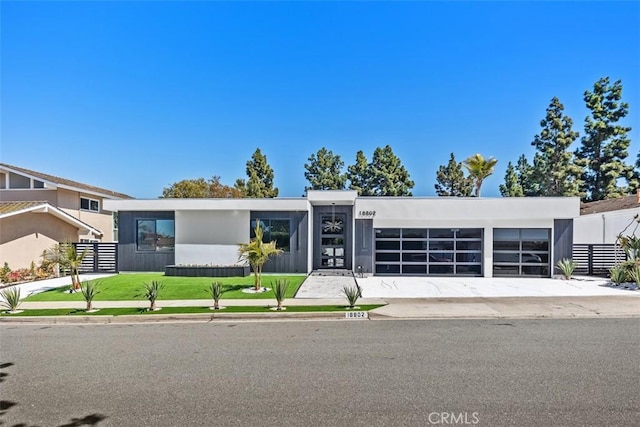 18802 Saginaw Dr, Irvine, CA 92603 - view of front of house with a garage, driveway, and stucco siding