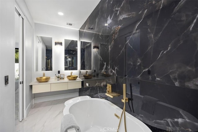18802 Saginaw Dr, Irvine, CA 92603 - bathroom featuring a freestanding tub, double vanity, marble finish floors, and baseboards