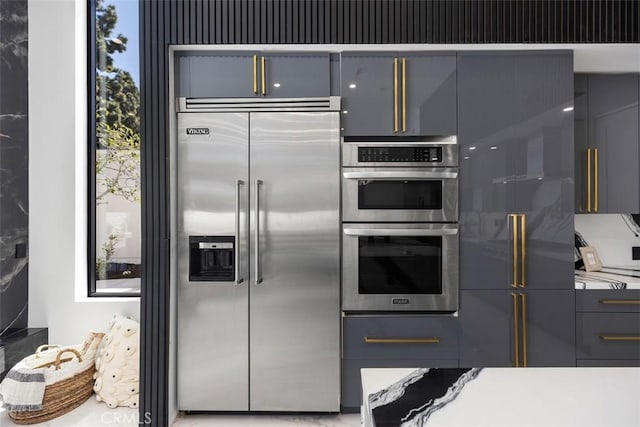18802 Saginaw Dr, Irvine, CA 92603 - kitchen featuring appliances with stainless steel finishes, gray cabinets, and modern cabinets