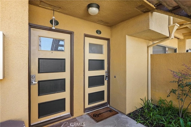 25712 Le Parc Unit 21, Lake Forest, CA 92630 - doorway to property featuring stucco siding