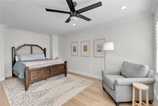 bedroom featuring crown molding, baseboards, wood finished floors, recessed lighting, and a ceiling fan