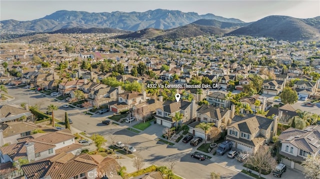 drone / aerial view with a residential view and a mountain view