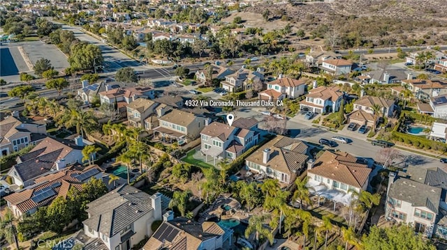 birds eye view of property with a residential view